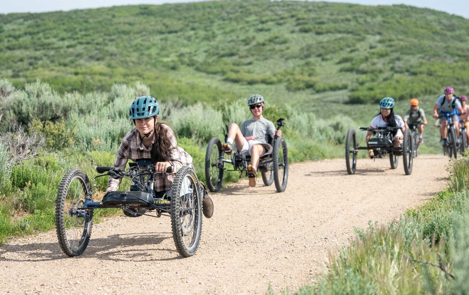 Cozy Method Park City experiences guide: riders on adaptive cycles using the paved trail system in Park City, Utah