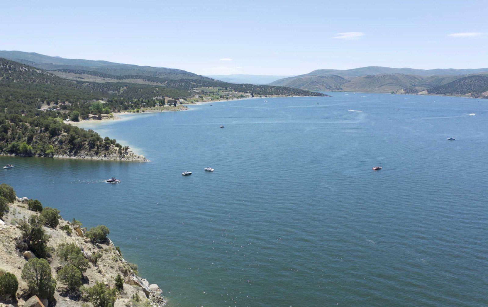 Cozy Method Park City experiences guide: an aerial view of open water and boats on a reservoir near Park City, Utah