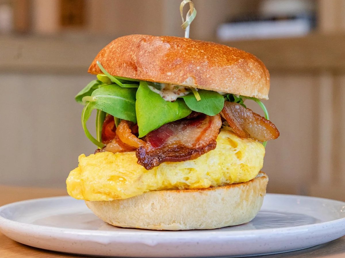 Cozy Method Park City breakfast and brunch guide: the bacon and egg breakfast sandwich with Gruyère and chili jam at Five5eeds in Park City