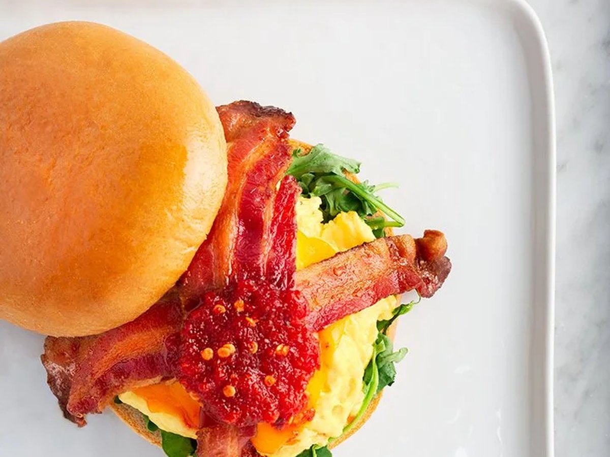 Cozy Method Park City breakfast and brunch guide: the Breakfast Brioche with scrambled eggs, bacon, and chili jam at Harvest in Park City