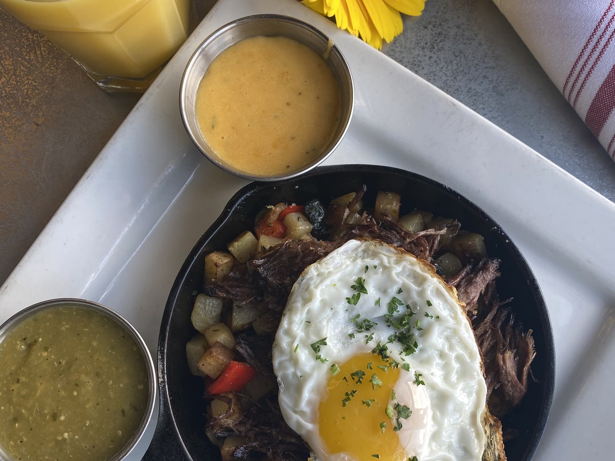Cozy Method Park City burger guide: a weekend brunch skillet with a fried egg and salsas at Boneyard Saloon in Park City