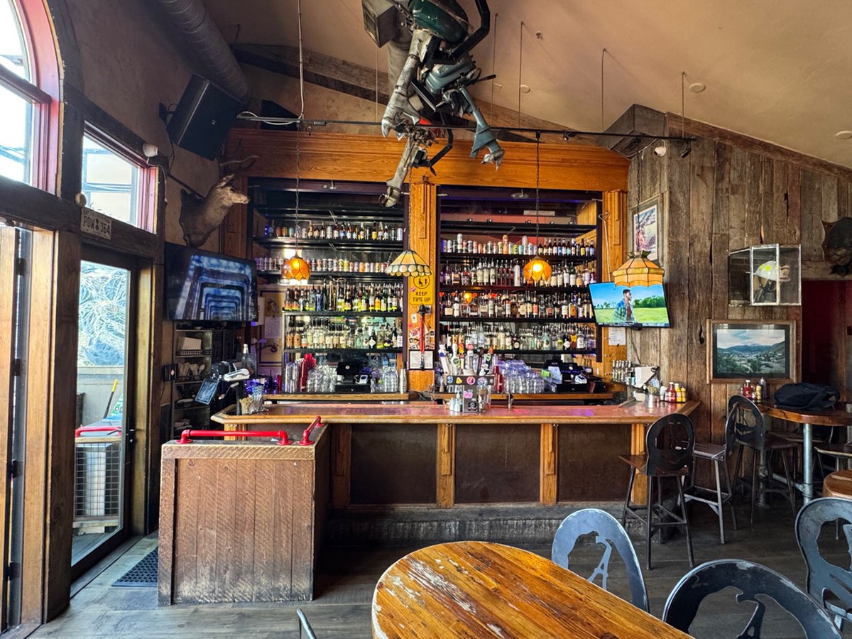 Cozy Method Park City burger guide: the bar back and whiskey shelf inside No Name Saloon on Main Street in Park City