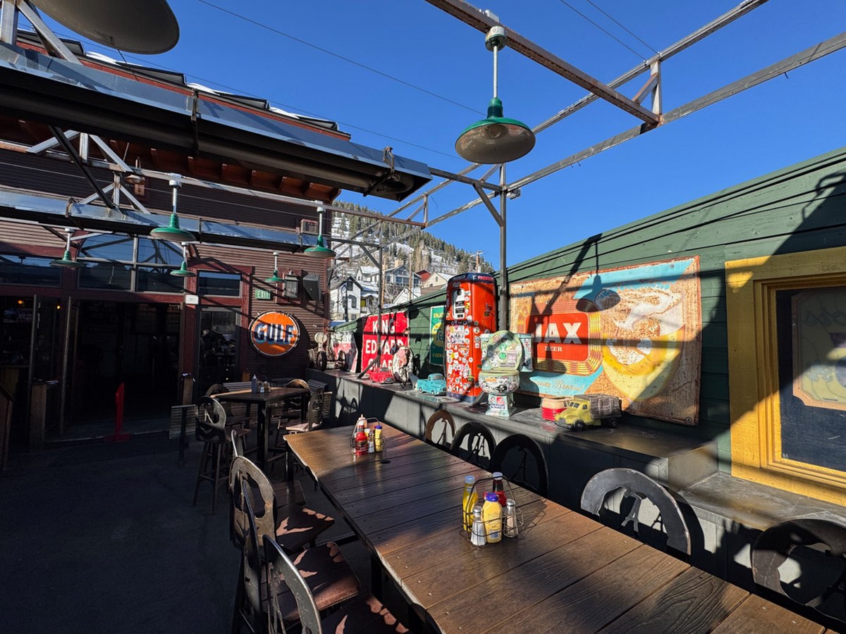 Cozy Method Park City burger guide: the heated rooftop patio strung with lights at No Name Saloon in Park City
