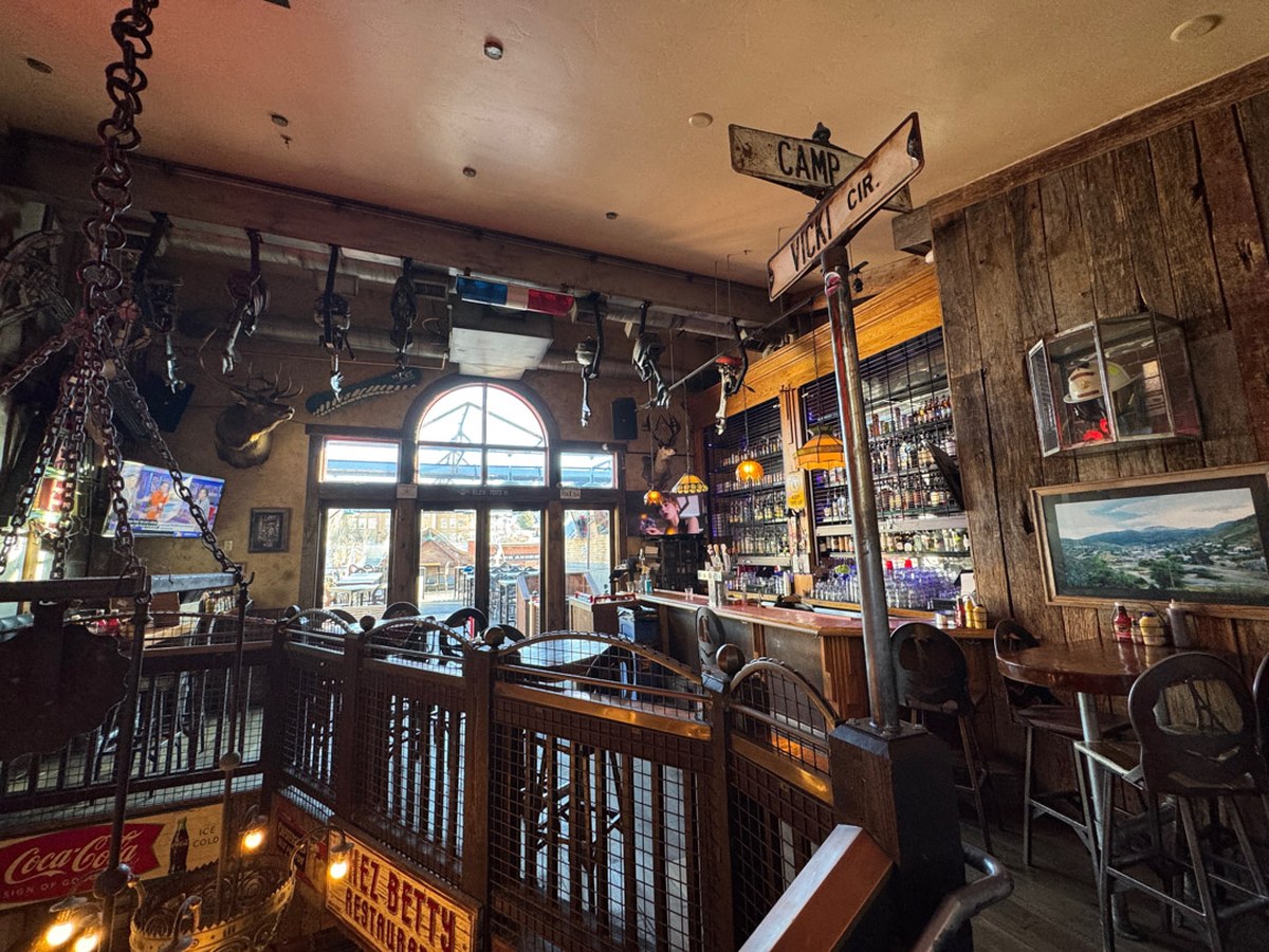Cozy Method Park City burger guide: the upstairs bar and Main Street windows inside No Name Saloon in Park City