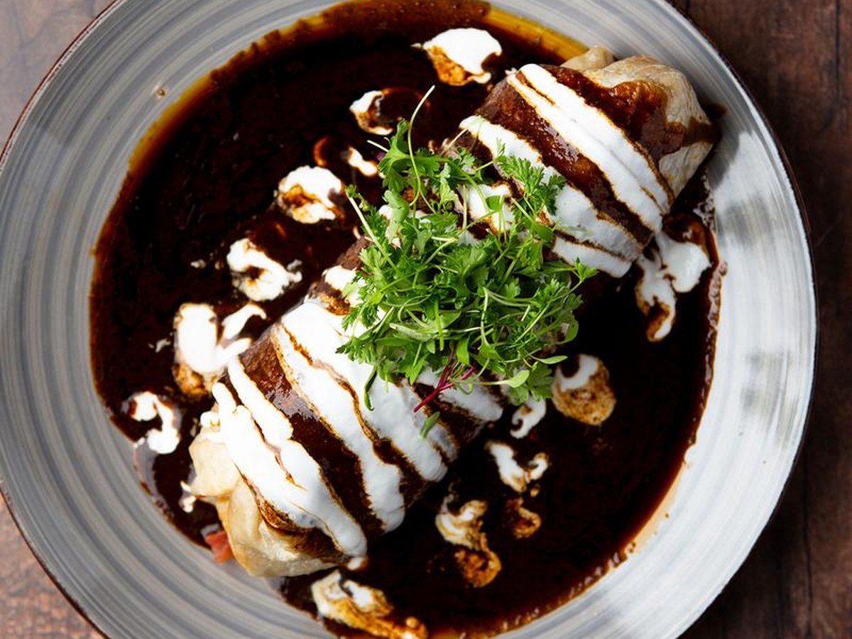 Cozy Method Park City Mexican restaurant guide: salmon with black mole plated at Mi Buena Vida in Salt Lake City