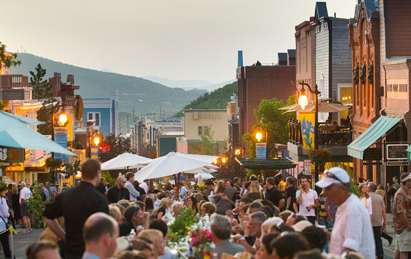 Cozy Method Park City experiences guide: an evening crowd filling Historic Main Street during a summer event in Park City