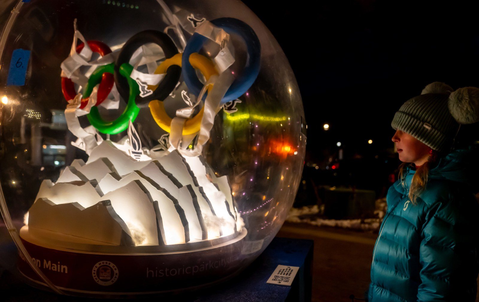 Cozy Method Park City experiences guide: an evening stroll through a snowy Park City village after a ski day