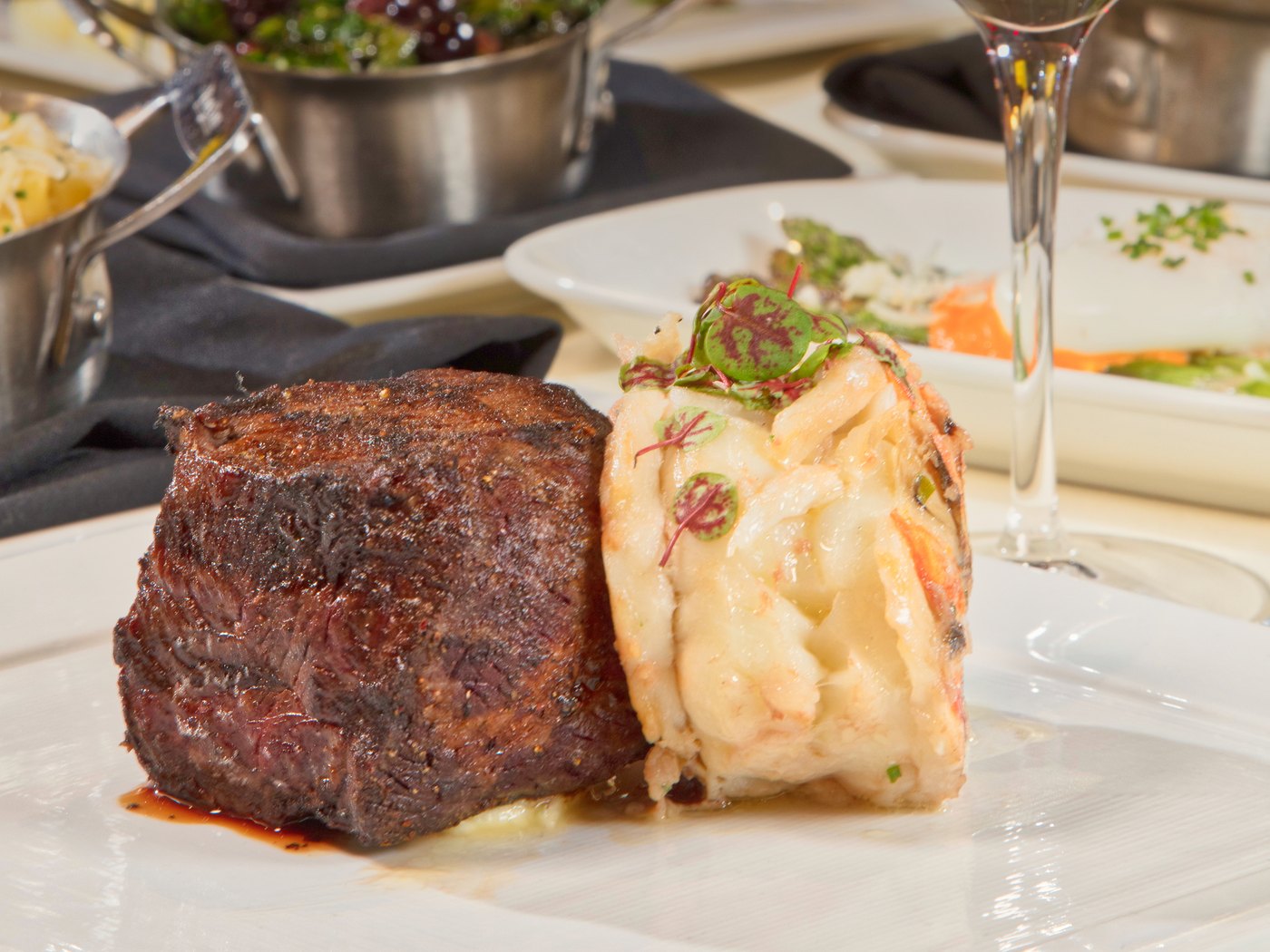 Cozy Method Park City steakhouse guide: dry-aged steak served with lobster at Edge Steakhouse in Park City