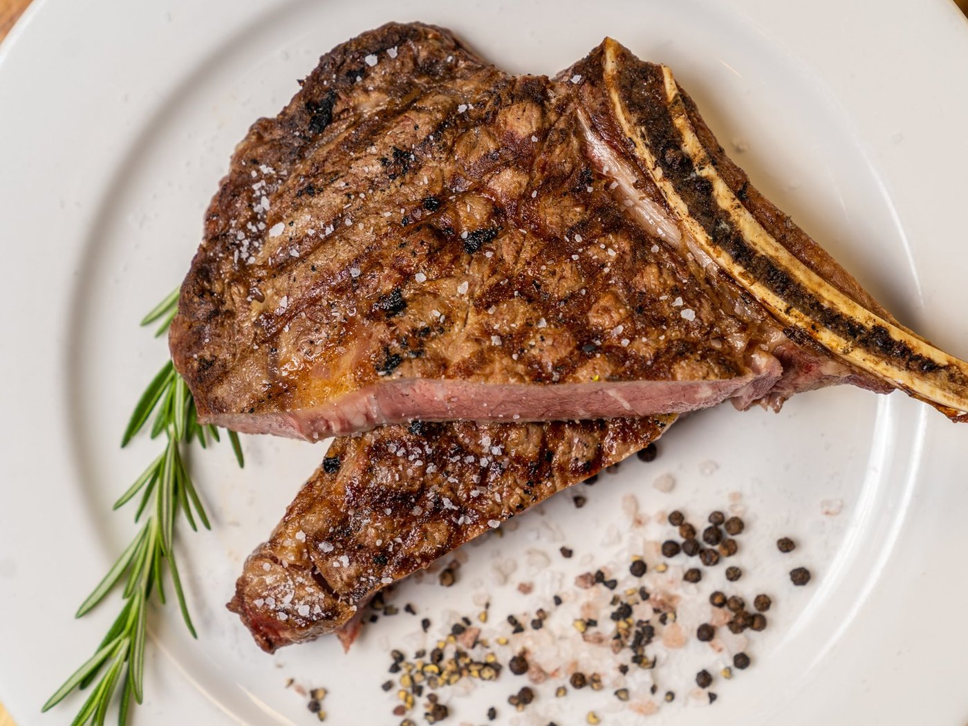 Cozy Method Park City steakhouse guide: a 40 oz tomahawk ribeye plated at Grub Steak in Park City