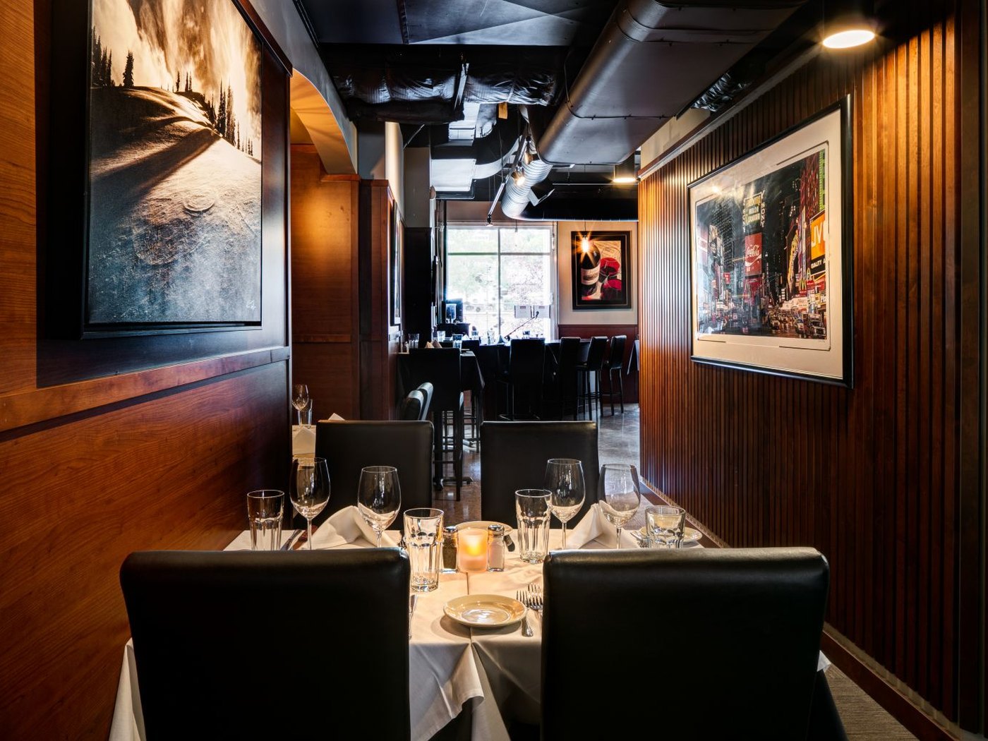 Cozy Method Park City steakhouse guide: an intimate corner booth set for two at Prime Steak House and Piano Bar in Park City