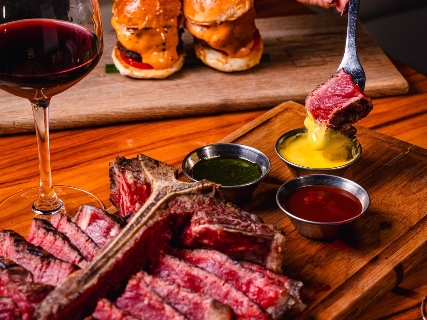 Cozy Method steakhouse guide: a sliced tomahawk ribeye served on a board at STK Steakhouse in Salt Lake City